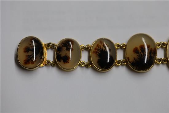 A late Victorian gold and moss agate bracelet, approximately 17cm.